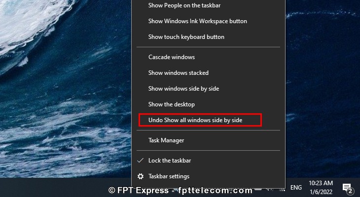 Chọn Undo Show all windows side by side để tắt chế độ chia đôi màn hình